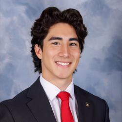 A professional headshot of JP Davalos.